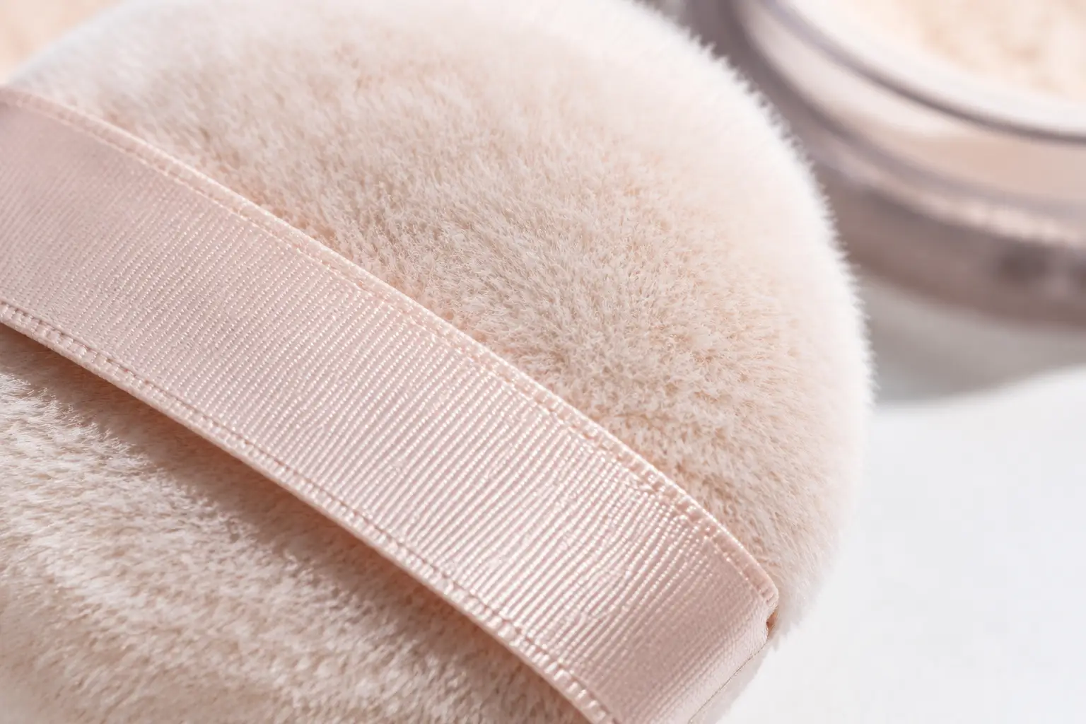 Precision Flocked Powder Puff for targeted facial contouring